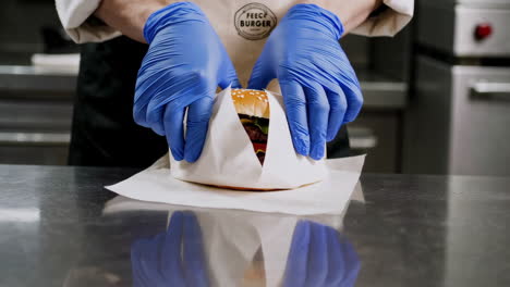 chef preparing a burger in a restaurant kitchen