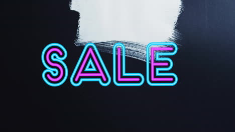 animación del texto de venta en rosa y azul sobre pinceladas blancas en negro