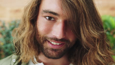 happy, playful and face of man with long hair