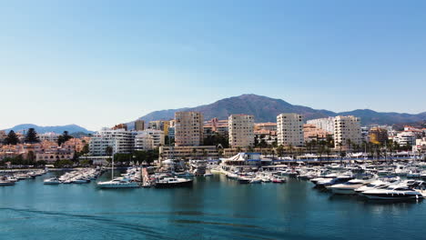 a drone rises up over the skyline of estepona, spain