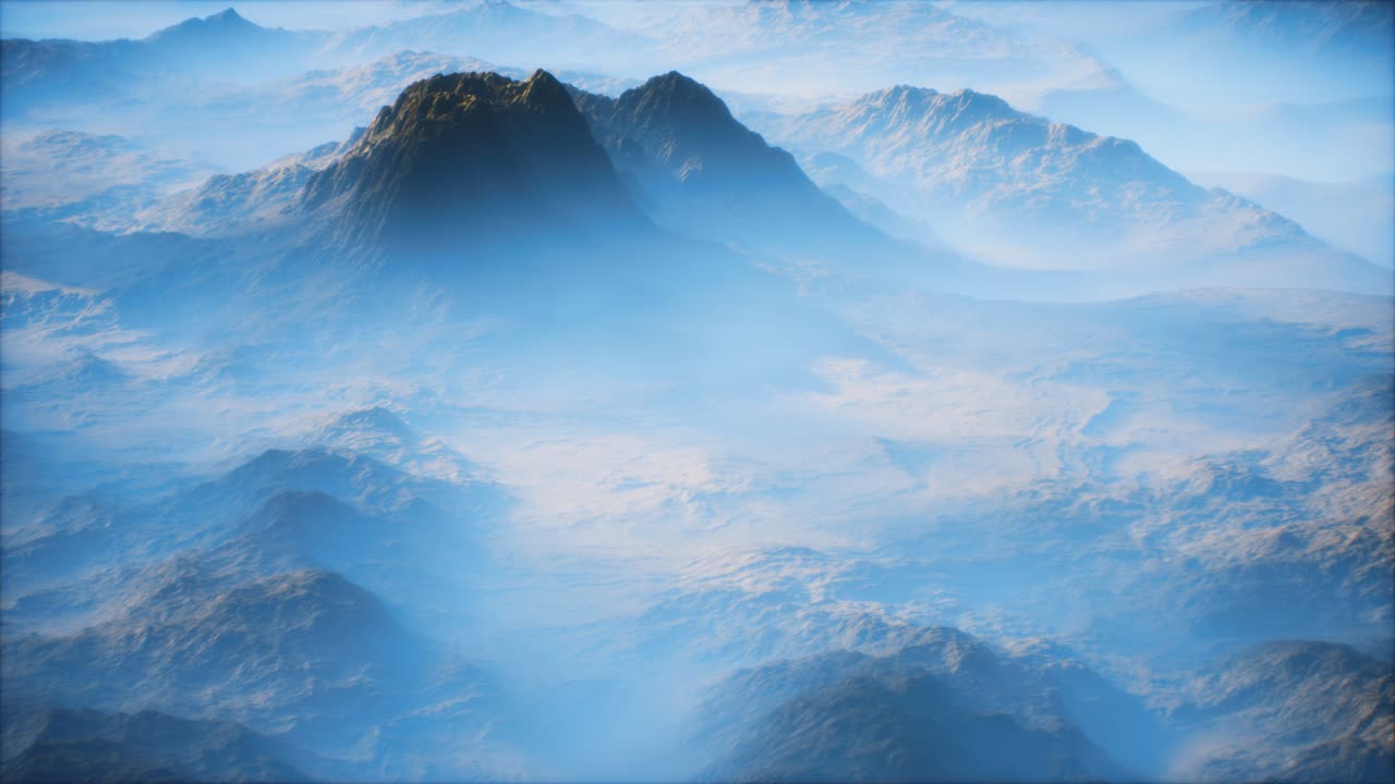 Distant mountain range and thin layer of fog on the valleys