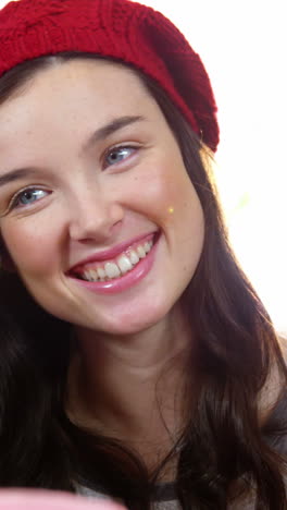 woman smiling while interacting with friend