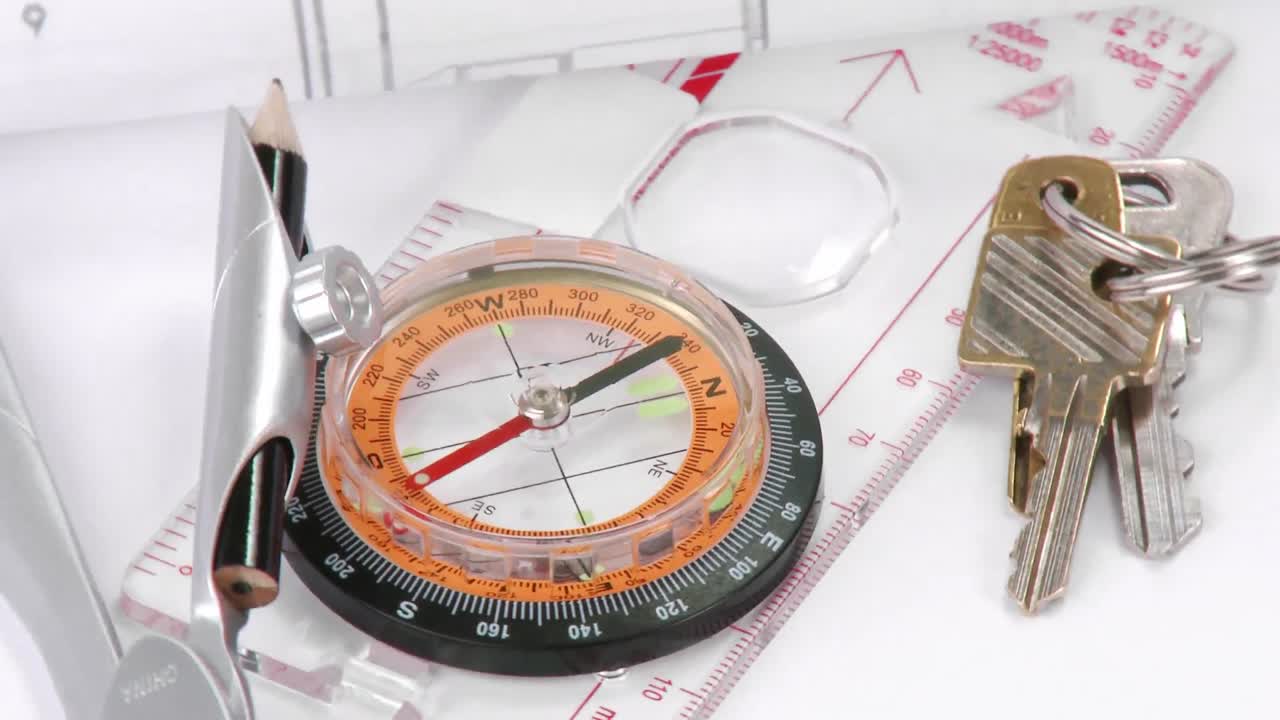 Blueprints, compass and keys turning