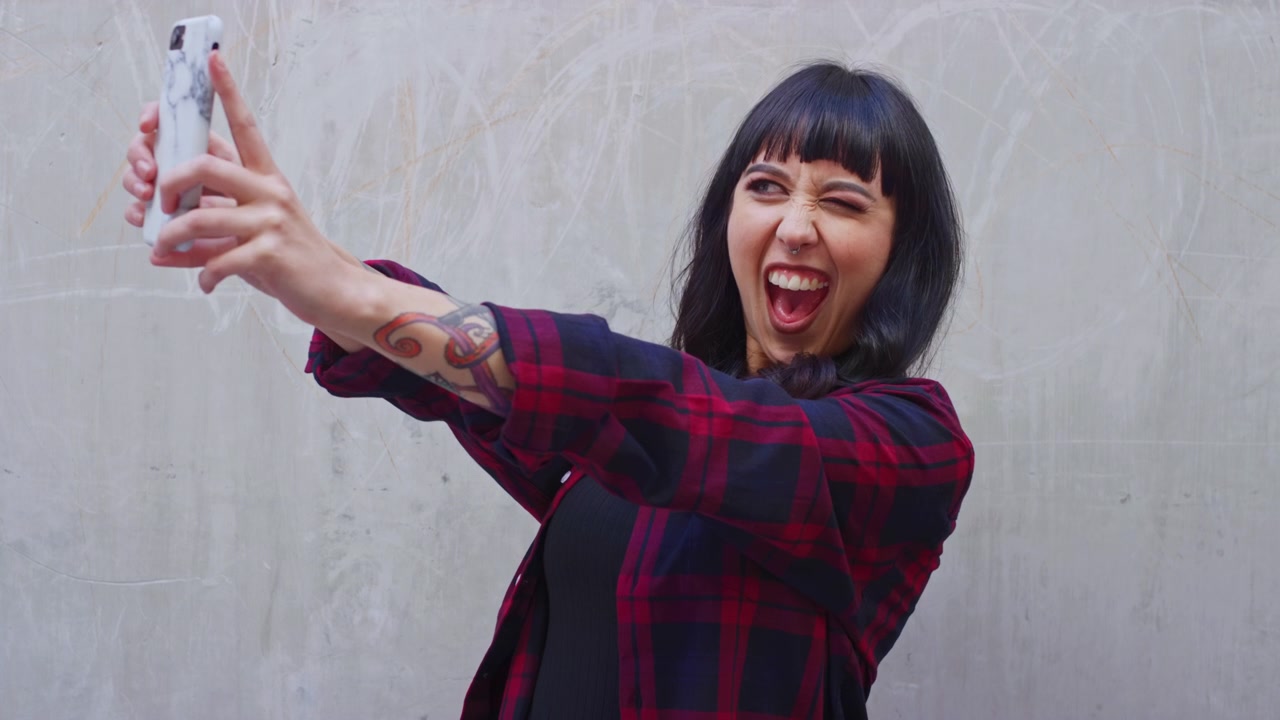 Young Woman Taking a Selfie with Her Smartphone