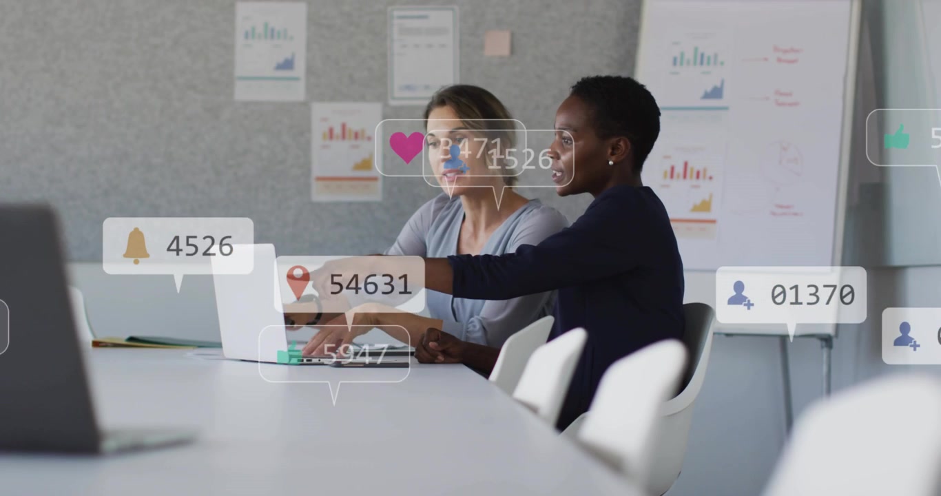 Right woman pointing and left peer typing, driving marketing overlays likes hearts followers rising