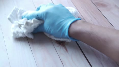 cleaning wood surface with a cloth