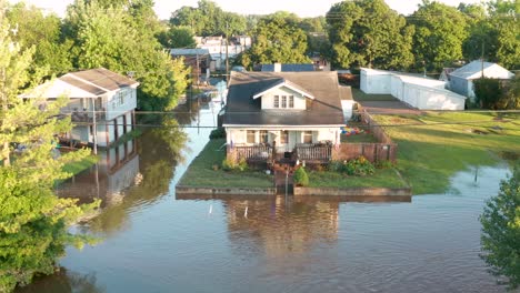 american flag on home after flooding in usa town