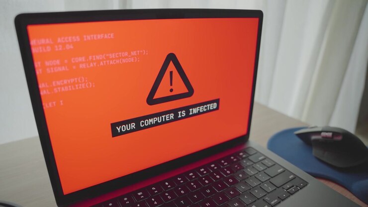 Close up on laptop glitching and message warning of potential virus infection or malware appears on screen. Connection problems as computer being hacked and breach remotely. Cyber threat on user data