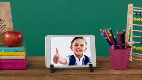 animation of a digital tablet showing caucasian boy giving thumbs up on the screen