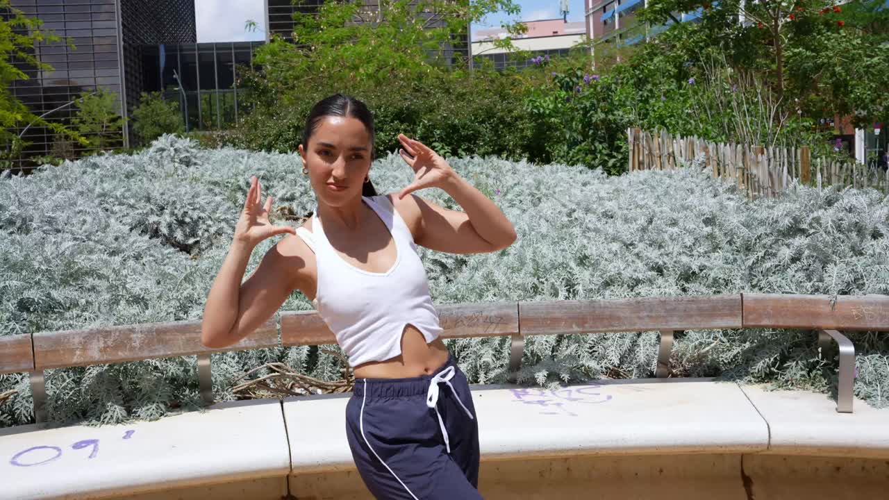 Woman dancing in an urban park