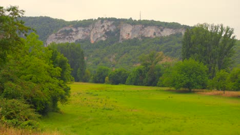 random locationa beautiful view of the lush, green landscape and majestic rock formations within the quercy geopark, showcasing the natural beauty of rural france