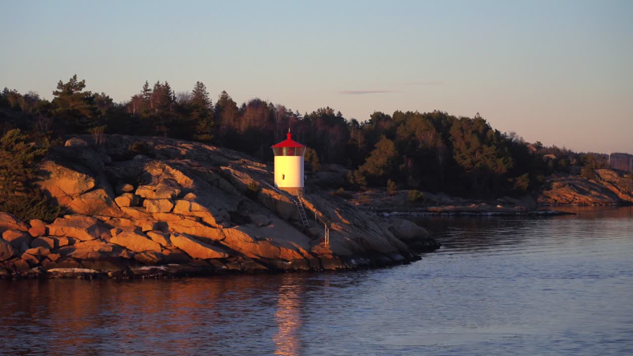 Sandefjord lighthouse buildings coastal seaside town tower marina Strömstad Stromstad Sweden Sverige coastline OsloFjord Nakholmen Island inner Scandaniva sunset golden hour yacht ferry boat zoom in