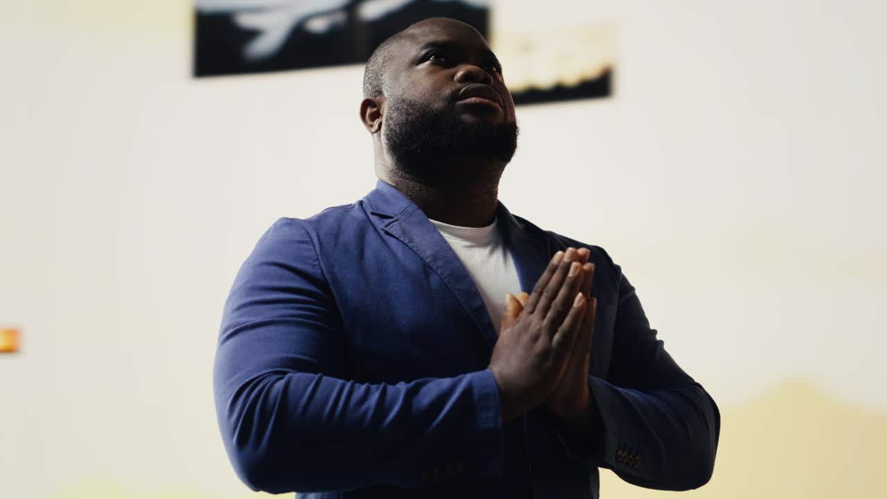 Spiritual believer meditates on faith and holiness in a pose of worship