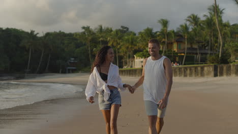 young man and woman running outdoors