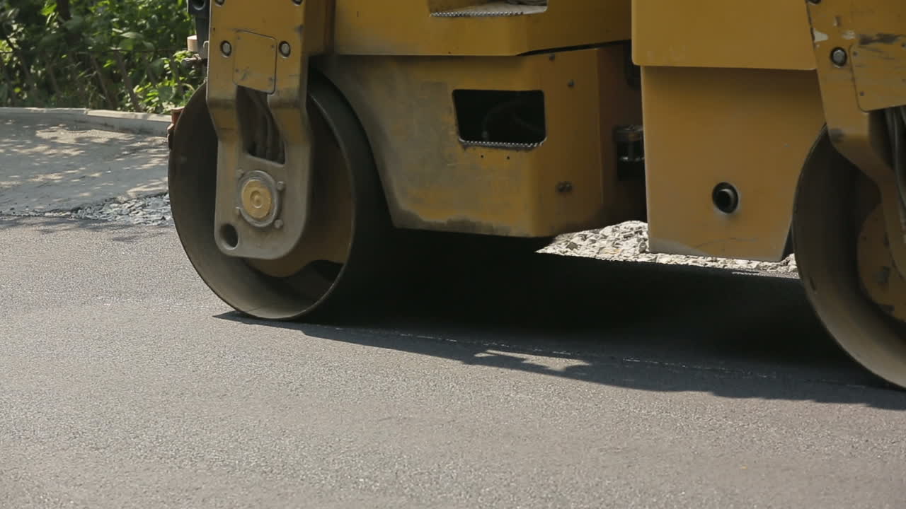 Steamroller during the asphalt laying on the road construction site