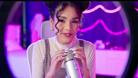 Woman with microphone and ring light