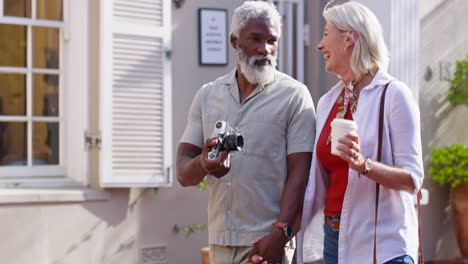 elderly couple walking and holding hands on the street