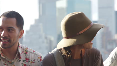 friends visiting new york with manhattan skyline in background