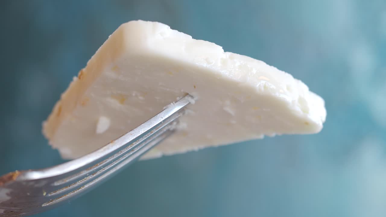 Piece of White Cheese on a Fork