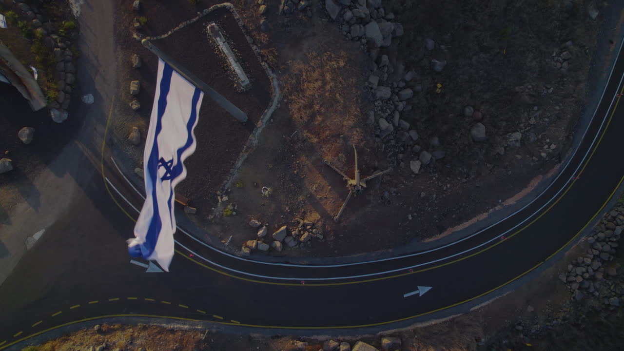 Top down view on the Israeli flag found on a volcano where they built a bunker with large combat equipment, the site of one of the most critical battles of the Yom Kippur War on 1973