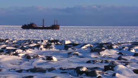 a ship sits trapped in the ice of frozen hudson bay churchill manitoba canada 2