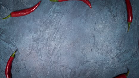 looped stop motion animation of red hot peppers.