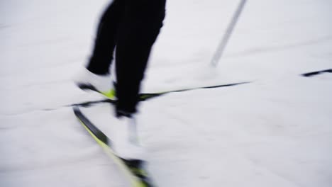 Dramatic-close-up-of-skiier-working-his-way-up-steep-hill