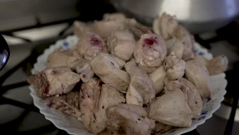 pile of cooked meat chicken pieces on plate