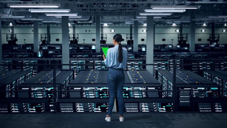 Woman monitoring server room