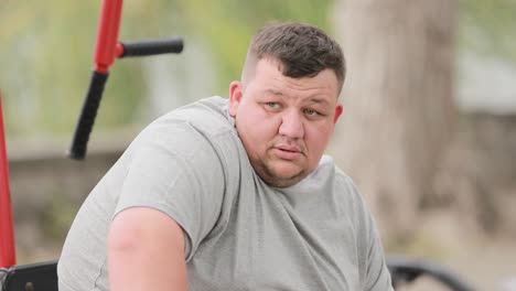portrait of an overweight man he is looking at the camera the problem of losing weight close up portrait of an overweight man he is looking at the camera the problem of losing weight close up