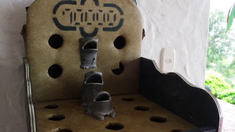 a person throwing some rings towards the traditional game table called rana or sapo.static