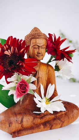 buddha statue with flowers