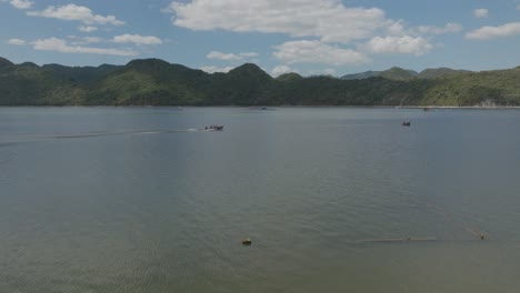 Drone-flying-at-low-altitude-over-calm-waters-of-Hatillo-embankment-dam-in-Dominican-Republic