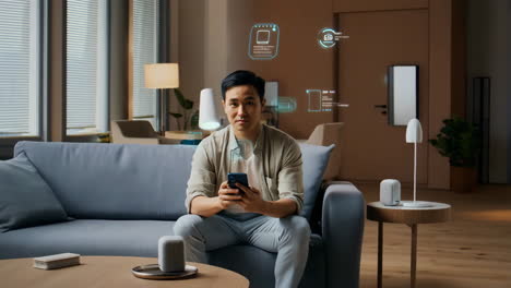 man interacting with smart home technology and holographic displays