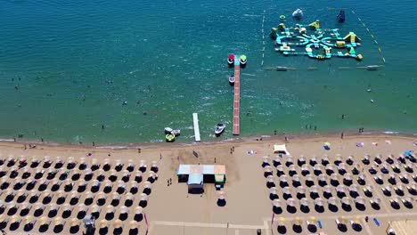 tsambika beach in faliraki, rhodes in greece filmed with the drone from above with mediterranean sea in the summer holiday