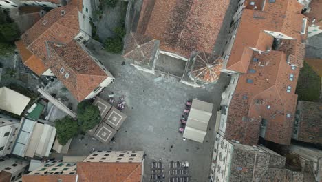 people walking over pjaca sv tripuna before the st tryphon cathedral in kotor