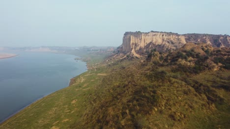 Aerial-drone-shot-of-sand-and-clay-Hills-of-Chambal-River-Valley-with-semi-arid-moor-landscape-in-Beehad-of-Morena-Dholpur-of-Madhya-Pradesh-Rajasthan-of-India