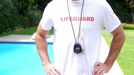 lifeguard standing at pool side