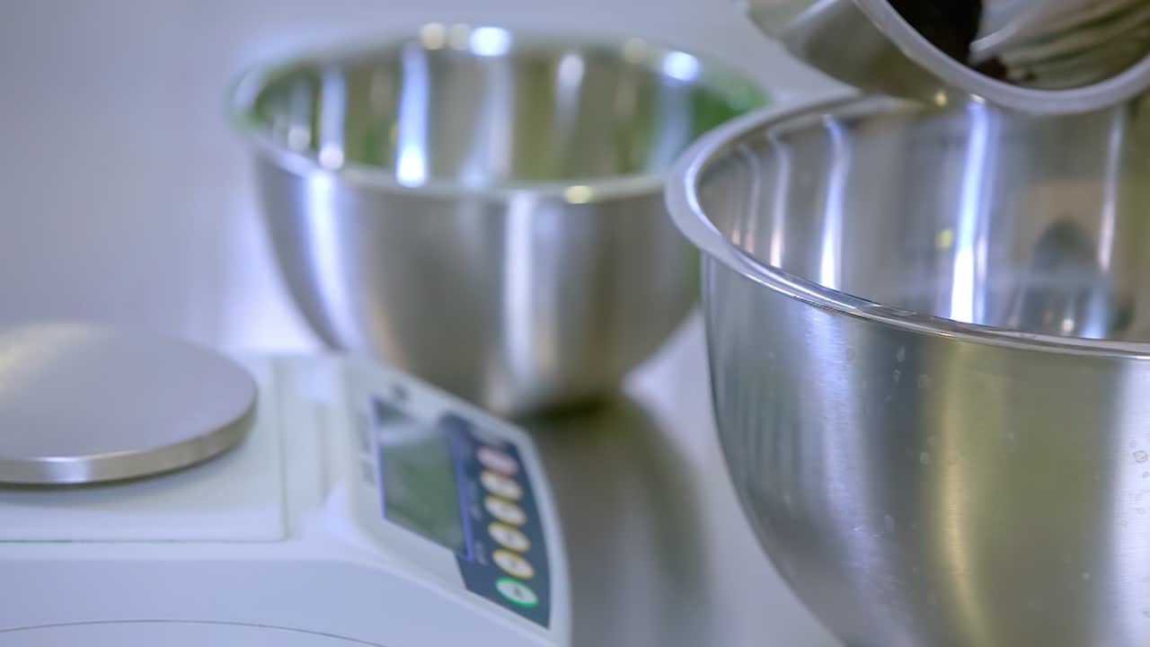 scientist at the lab weighing and mixing chemicals for Covid-19 treatment
