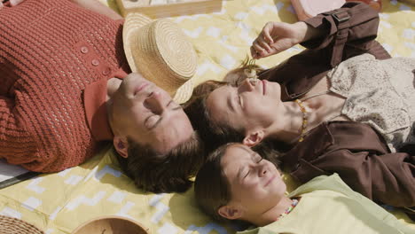 family relaxing during a picnic
