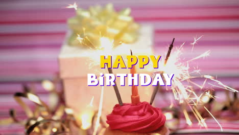 feliz cumpleaños escrito sobre cupcake y vela