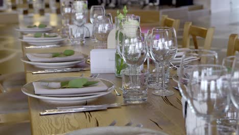 plates and glass on table setting for the event