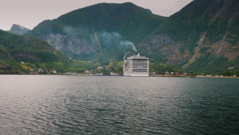 A-Huge-Ocean-Liner-Is-Moored-Off-The-Coast-Of-The-Picturesque-Norwegian-Fjord-4k-Video