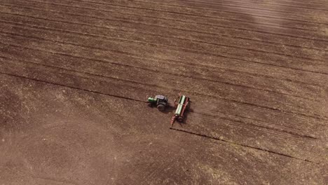 machinery tractor plowing in orbit at buenos aires argentina aerial