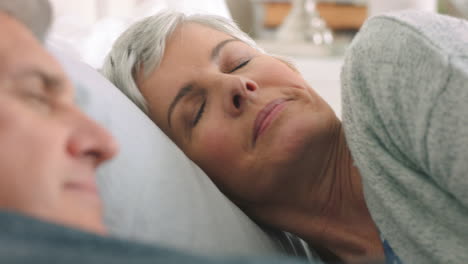 Comfortable-senior-couple,-sleeping-in-bedroom