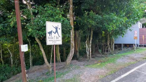 sign warns visitors about monkeys in area