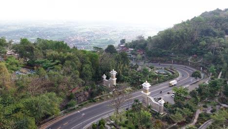 Aerial view of road traffic around the Gunung Kidul welcome monument