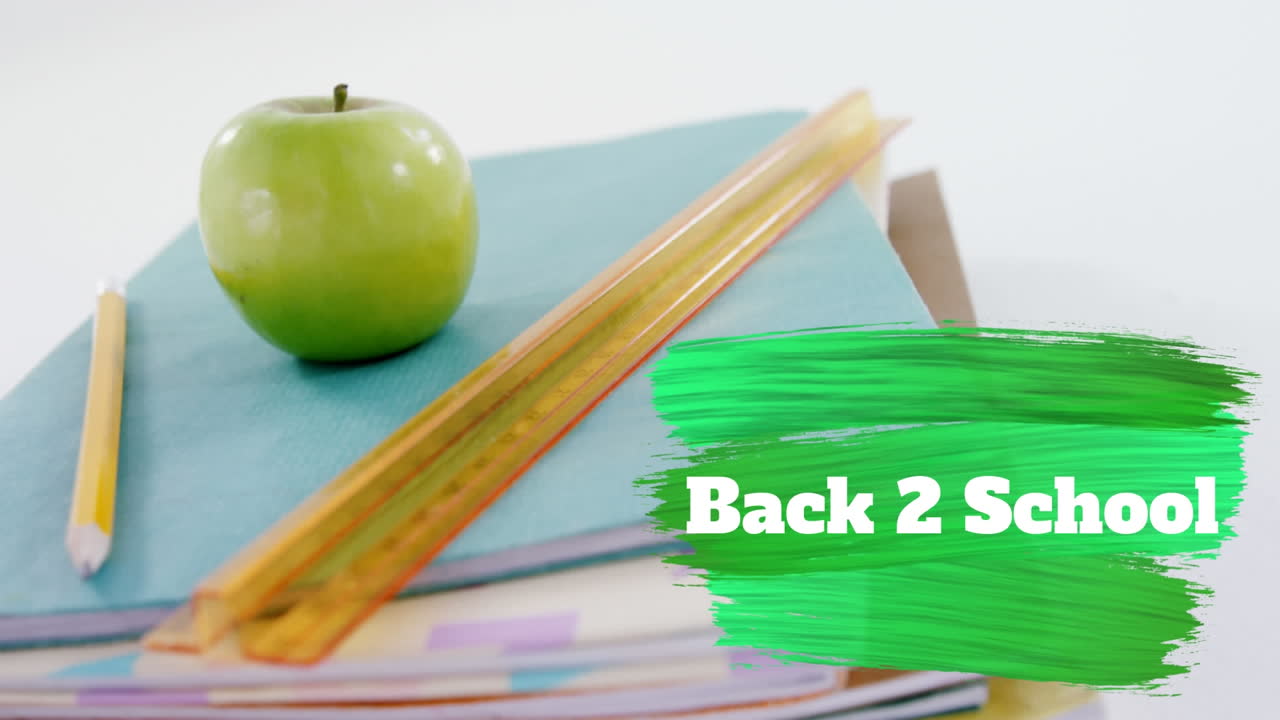 Back to school text against stack of books