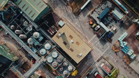 industrial plant with a futuristic look aerial drone footage, with a steampunk look with industrial buildings and vehicles