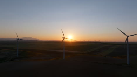 sunrise over a wind farm